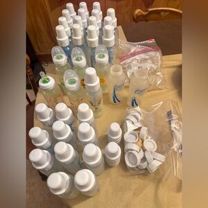 33 Dr. Brown’s bottles, caps, & extra nipples.